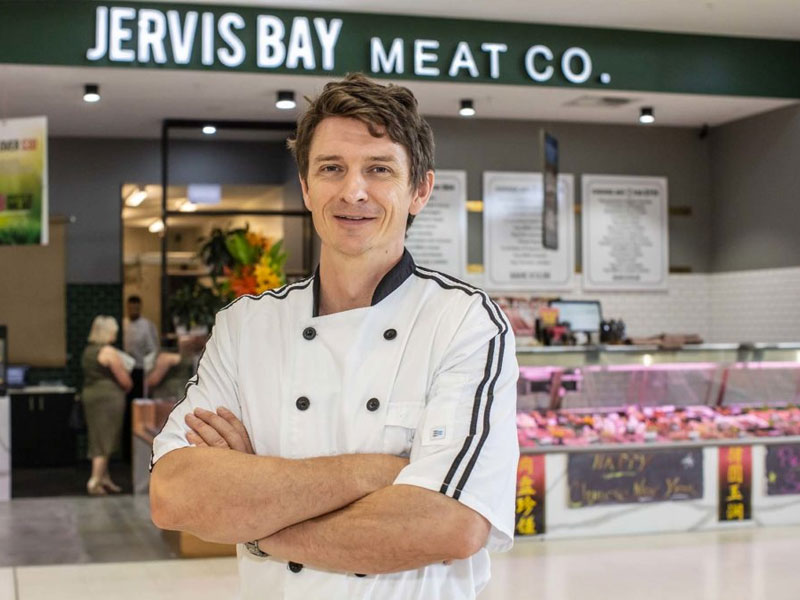 Jervis Bay Butcher - Steve in front of store.